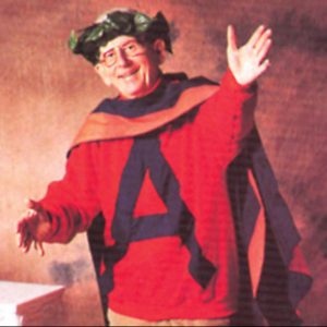 Scanlan in a red shirt with an A and wreath around head