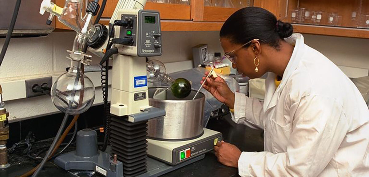 women scientist using a pipet and equipment