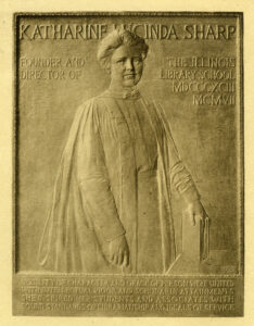stone tablet with image of Katharine Sharp stating Katharine Sharp, founder and director of the Illinois Library school, MDCCCXCIII, MCMVII, Nobility of character and grace of person were united with intellectual vigor and scholarly attainments, She inspired her students and associates with sound standards of Librarianship and ideals of service