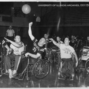 a group of people playing wheelchair basketball